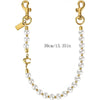 Gold-toned pearl purse charm keychain featuring a letter C detail.