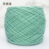 A ball of light mint green metallic silk crochet yarn for knitting and macrame.