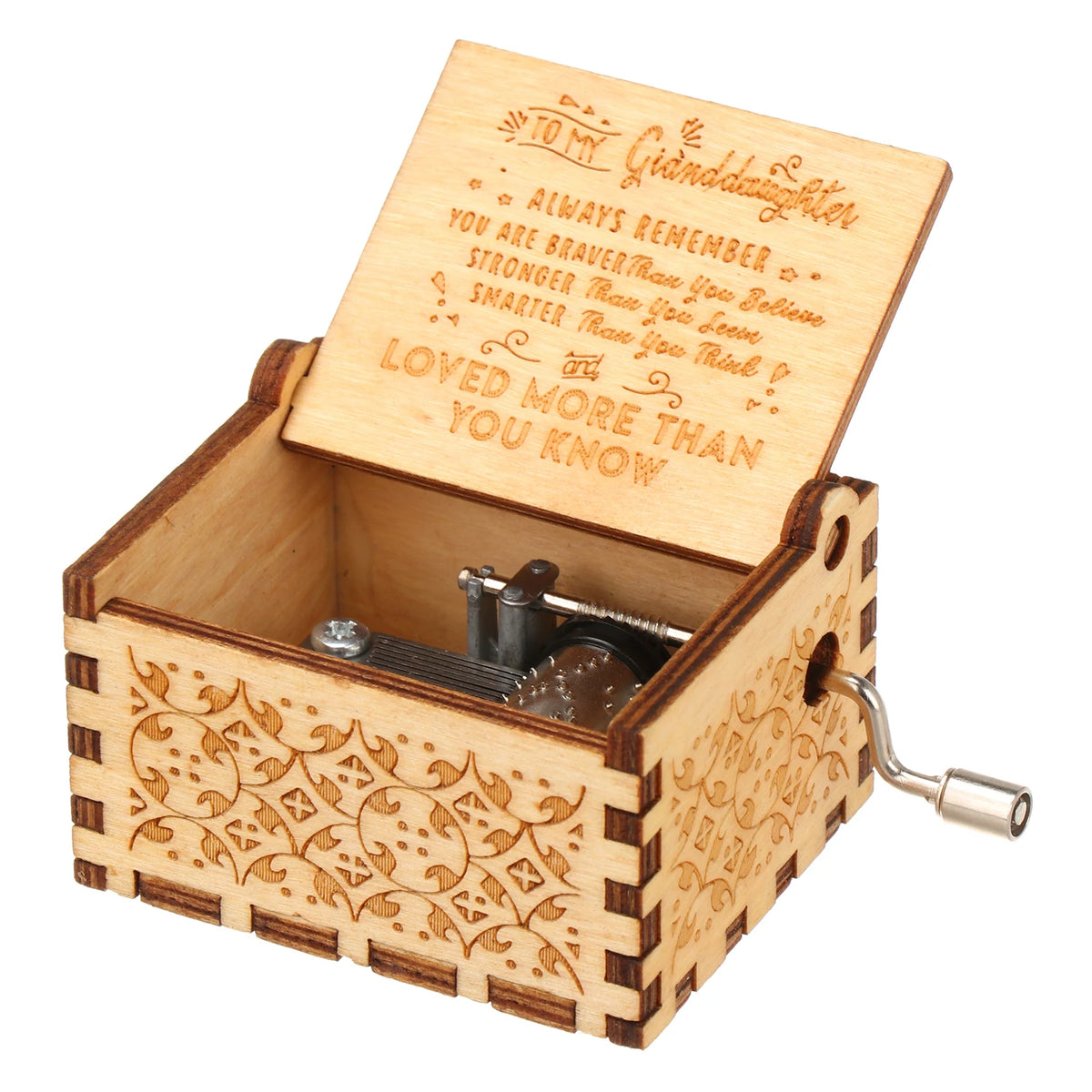 A vintage hand-cranked wooden music box with a lid open, featuring engraved text on the inside.
