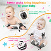 A baby is shown using a rattle set with wrist and foot finders to create crinkly and squeaky sounds.
