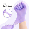 A hand wearing a purple disposable nitrile glove is shown, emphasizing tear resistance.