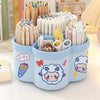 A light blue rotating desk organizer holding various colored pens and writing supplies.