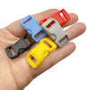 A hand holds several plastic side-release buckles in various colors including red, blue, gray, and yellow.