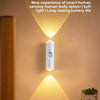 A white sensor light fixture mounted on a wall, illuminating the area with a warm glow.
