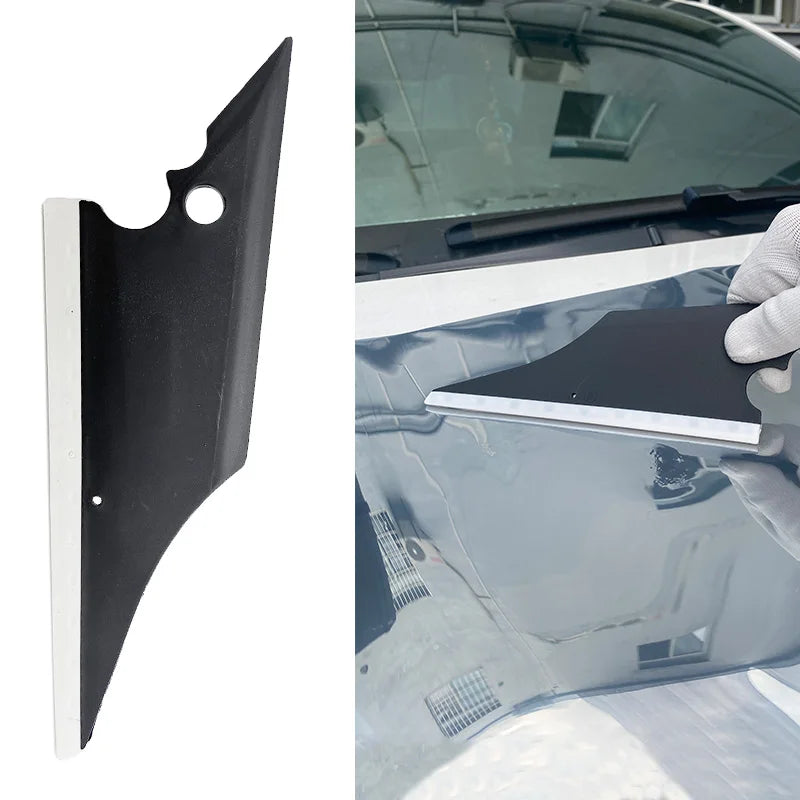 A black window tint kit with a white trim and mounting bracket shown installed on a car window.