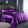 A vibrant purple silky duvet cover set displayed on a bed with dark gray curtains and modern decor.