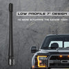 A black low profile 7 inch universal car radio antenna installed on the front of a truck.