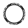 A black and gray camouflage steering wheel cover.