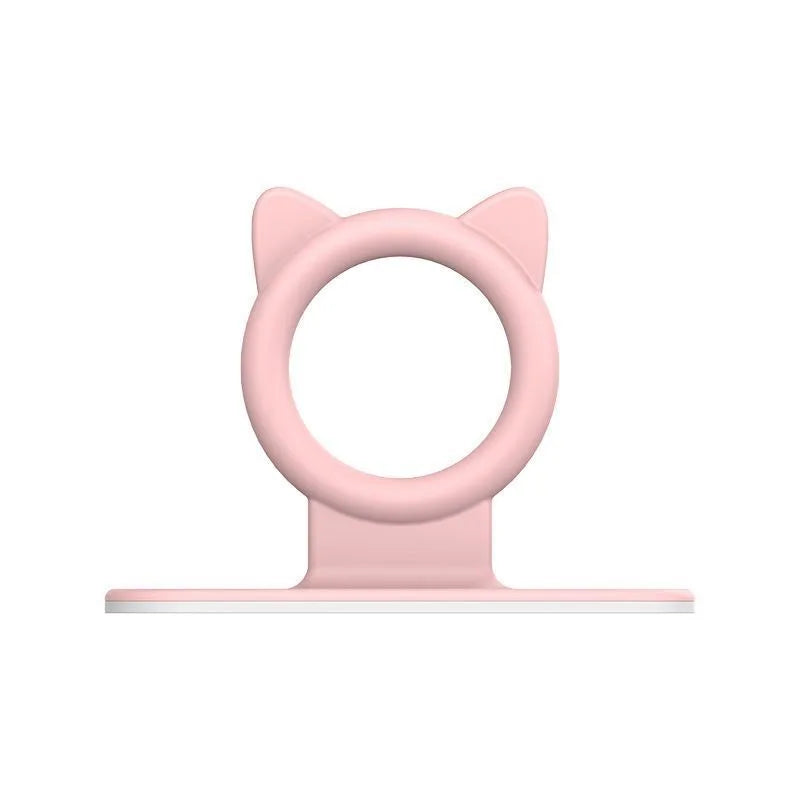 A pink silicone toilet lid lifter with a self-adhesive hook.