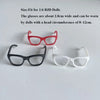 A set of fashion doll glasses in red, black, and white frames displayed on a white background.