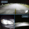 Comparison of high beam and low beam headlights on a road, showing light intensity differences.