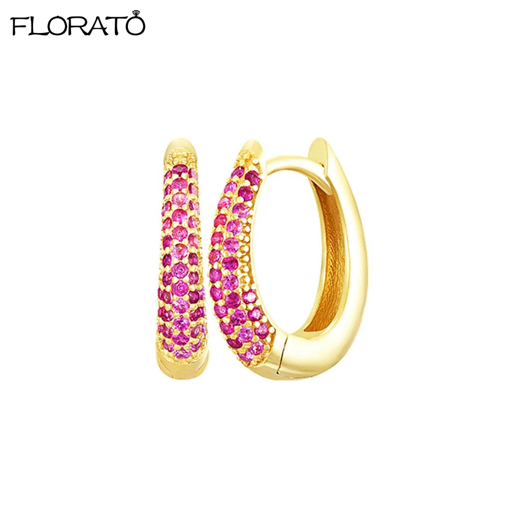 Gold-toned huggie hoop earrings encrusted with pink CZ stones