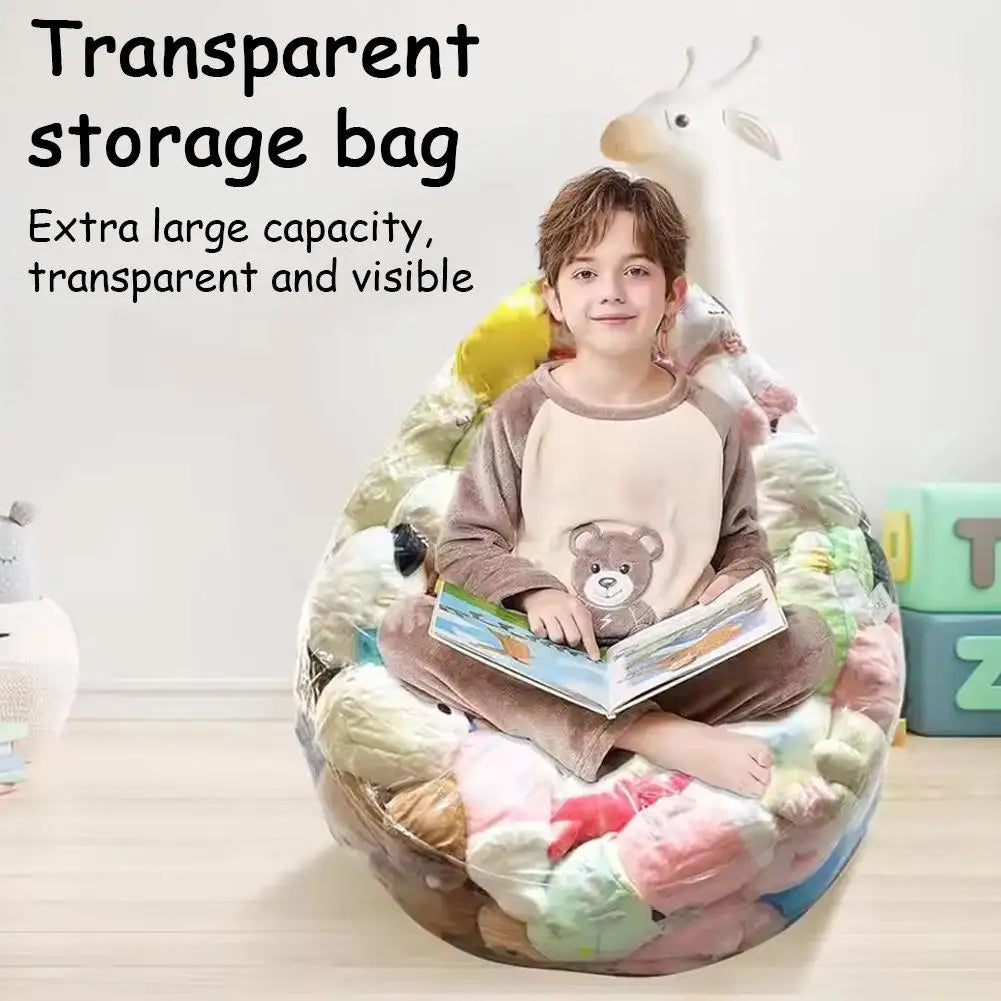 A boy is sitting inside a large, transparent storage bag filled with soft plush toys.
