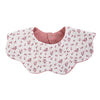 A pink floral patterned muslin cotton baby bib with an adjustable snap closure.
