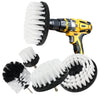 A yellow drill with various cleaning brushes including a rotating brush and several bristle brushes for tile and surface clea