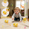 A yellow interactive dancing squid toy is shown with various components and a baby interacting with the toy on a carpet.