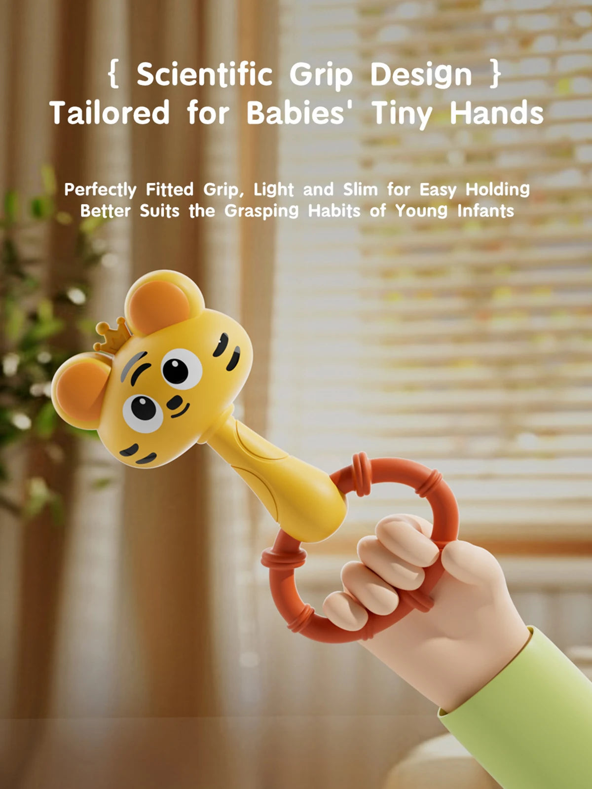 A hand is holding a yellow cartoon animal rattle toy with an orange ring for baby grasping practice.