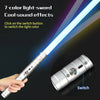 A hand holds a 7-color light-sword with sound effects, showing the switch mechanism.