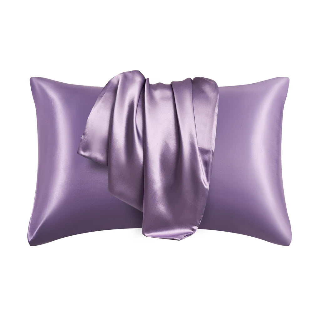 A purple silky smooth satin pillowcase with a gathered fabric detail.