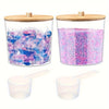 Clear acrylic detergent pod storage container with a wooden lid and a plastic spoon