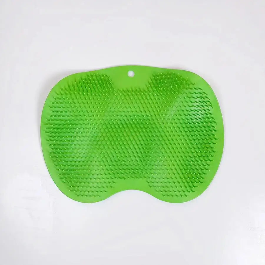 A bright green anti-slip silicone shower scrubber and massage pad for feet and back.