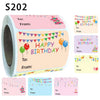 Roll of round adhesive gift tags with birthday messages in pink and yellow tones