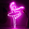 A neon silhouette of a ballet dancer in pink glows against a dark background.