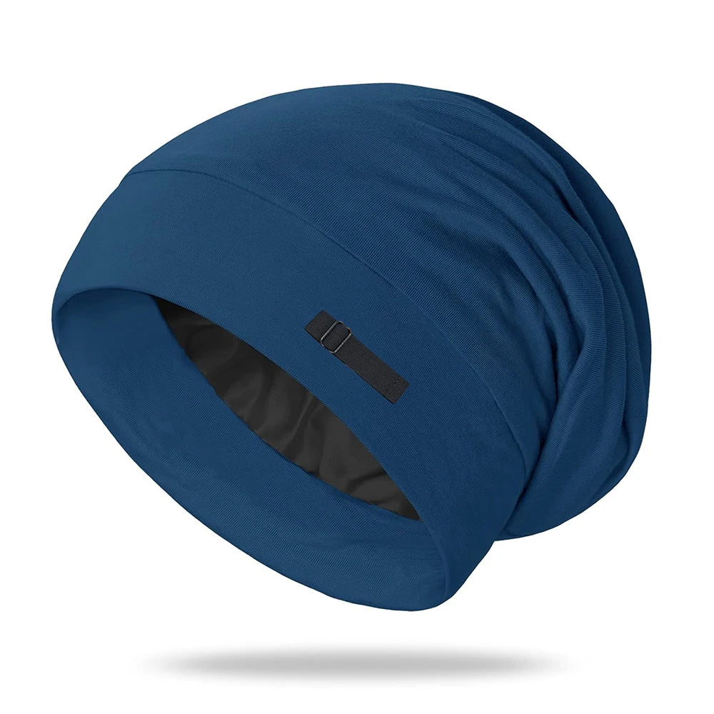 A deep blue silk-like night cap is shown folded, ready for use.