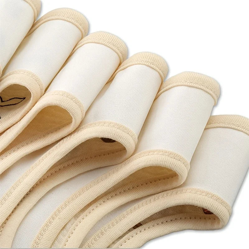 A close-up view of a two-pack of beige baby cotton gauze bibs with waterproof backing.