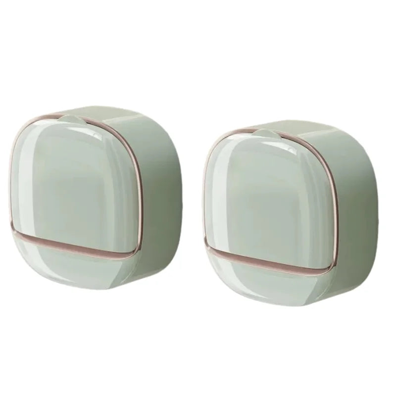 A pair of light green waterproof hanging soap holders with drainage features.