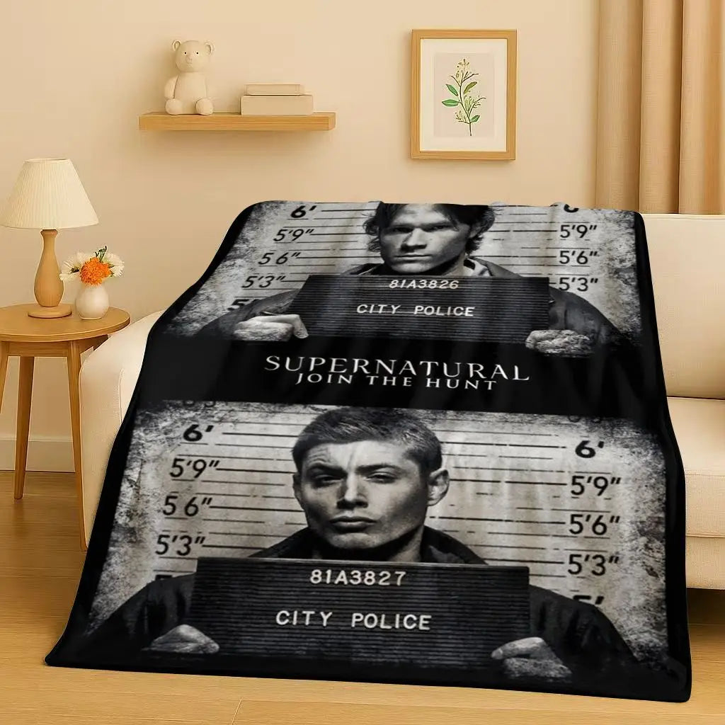 A black and white graphic blanket featuring a gritty portrait of a man with the text City Police and Supernatural Join the Hu
