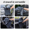 A dark gray microfiber towel is shown being used to dry a car's exterior and interior surfaces.