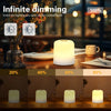 A row of touch-activated LED night lights showing various dimming levels on a wooden table.
