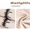 Close-up of a beige striped chenille sofa cover with a black pleated hem detail.