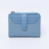 A light blue bi-fold wallet made of textured PU leather with a flap closure.