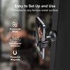 A magnetic phone holder with an aluminum base and 360-degree rotation mounted on a dark surface.