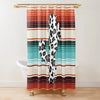 A leopard print shower curtain hanging from a gold rod against a striped background.