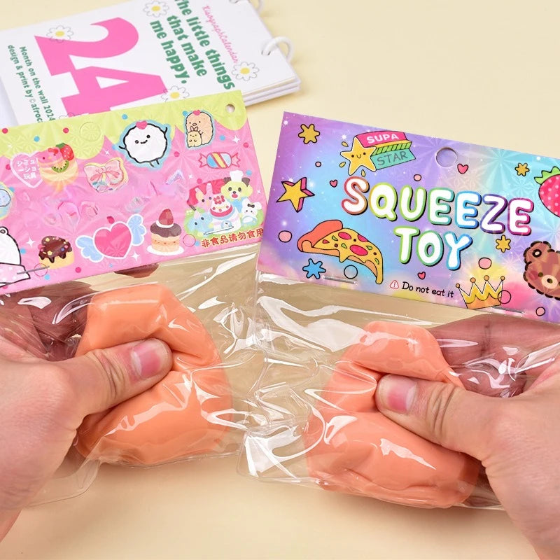 A hand is squeezing an orange squishy toy inside a clear plastic bag, next to a colorful card.