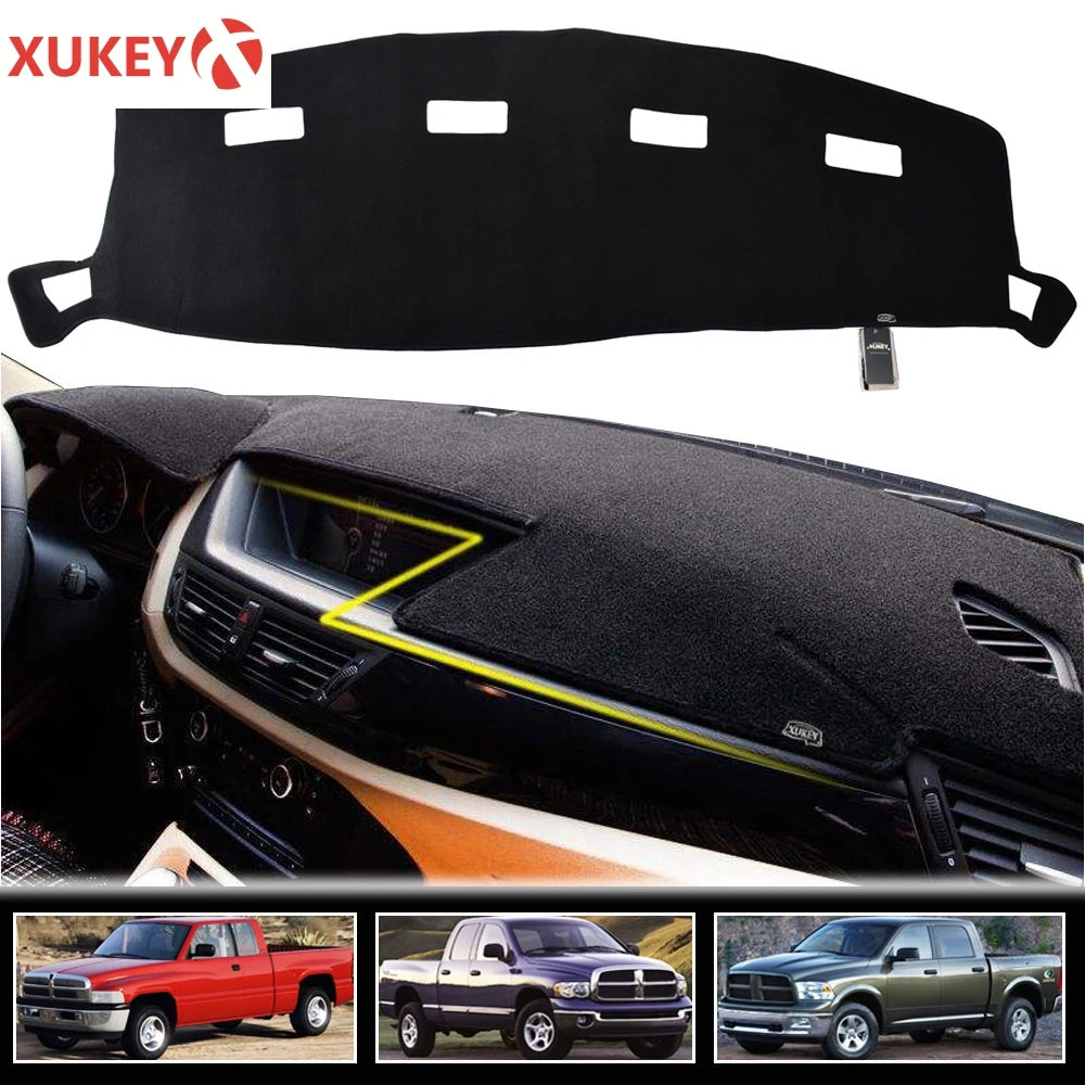 Black custom-fit dash cover for a Dodge Ram truck interior with yellow alignment lines visible.