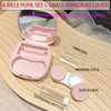 A pink 4-piece pupil set contact lens kit with a small mirror and accessories displayed on a wooden surface.