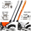 KTM side stand kit showing various components and an orange motorcycle with the installed stand.