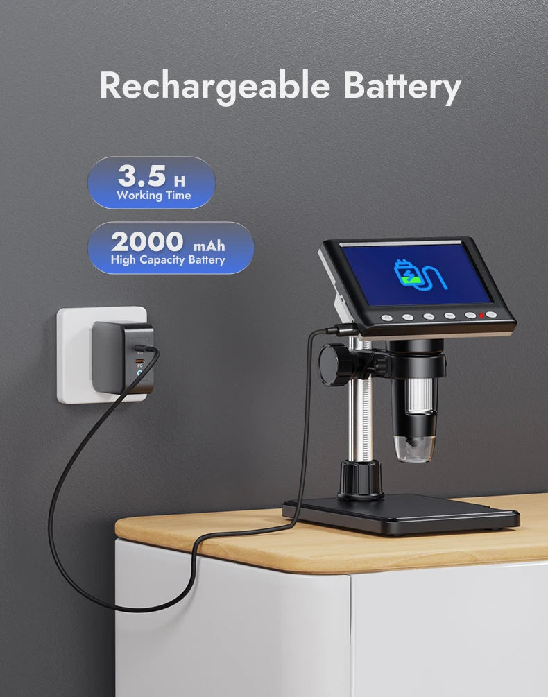 A digital microscope is shown on a wooden surface, connected to a charging cable and a wall outlet.