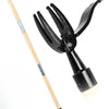 A black weed puller tool with a long wooden handle and adjustable claw for pulling weeds.
