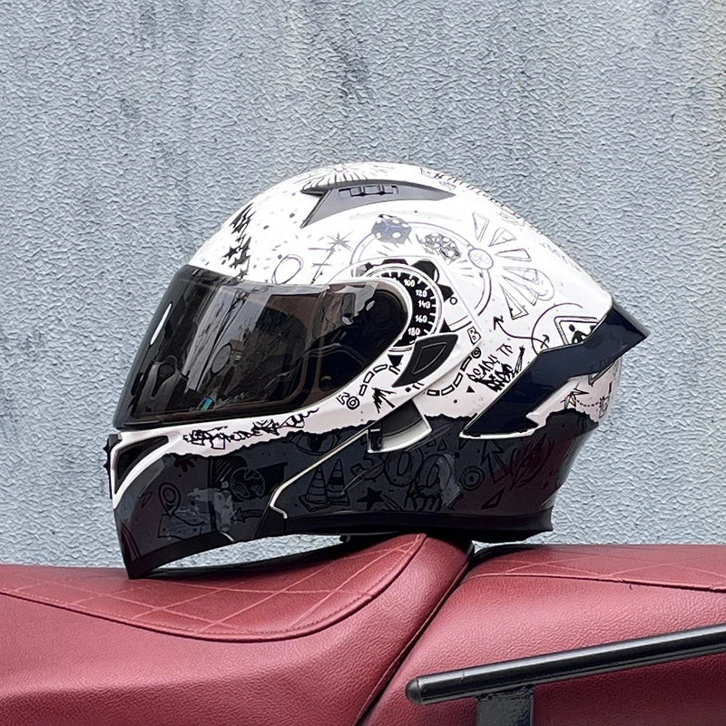 A black and white DOT-approved modular flip-up motorcycle helmet resting on a reddish-brown leather surface.