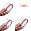 Three pairs of clear carbon fiber car side mirror rain and sun visors being held by a hand.