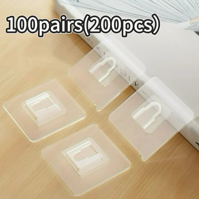 100 pairs of transparent double-sided adhesive wall hooks packaged in a box.