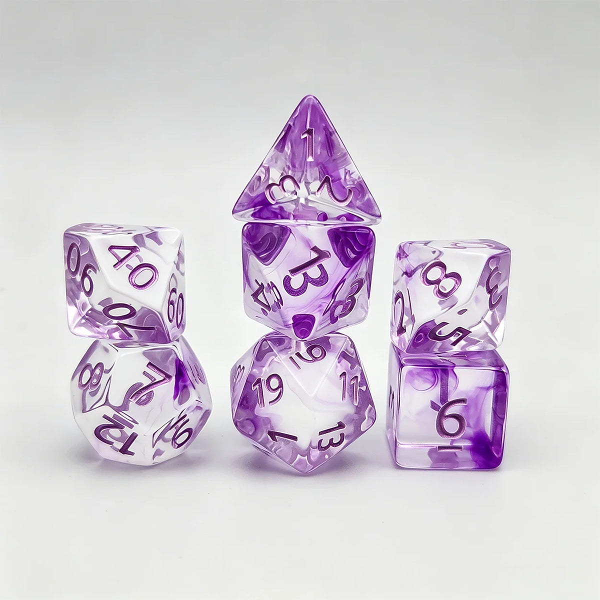 A set of seven purple polyhedral gaming dice, including a pyramid shape and various numbered dice.