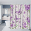 A purple floral shower curtain set featuring peonies and butterflies hanging in a bathroom.