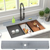 A silicone faucet drain mat is shown protecting a kitchen countertop, featuring a faucet and fruit.