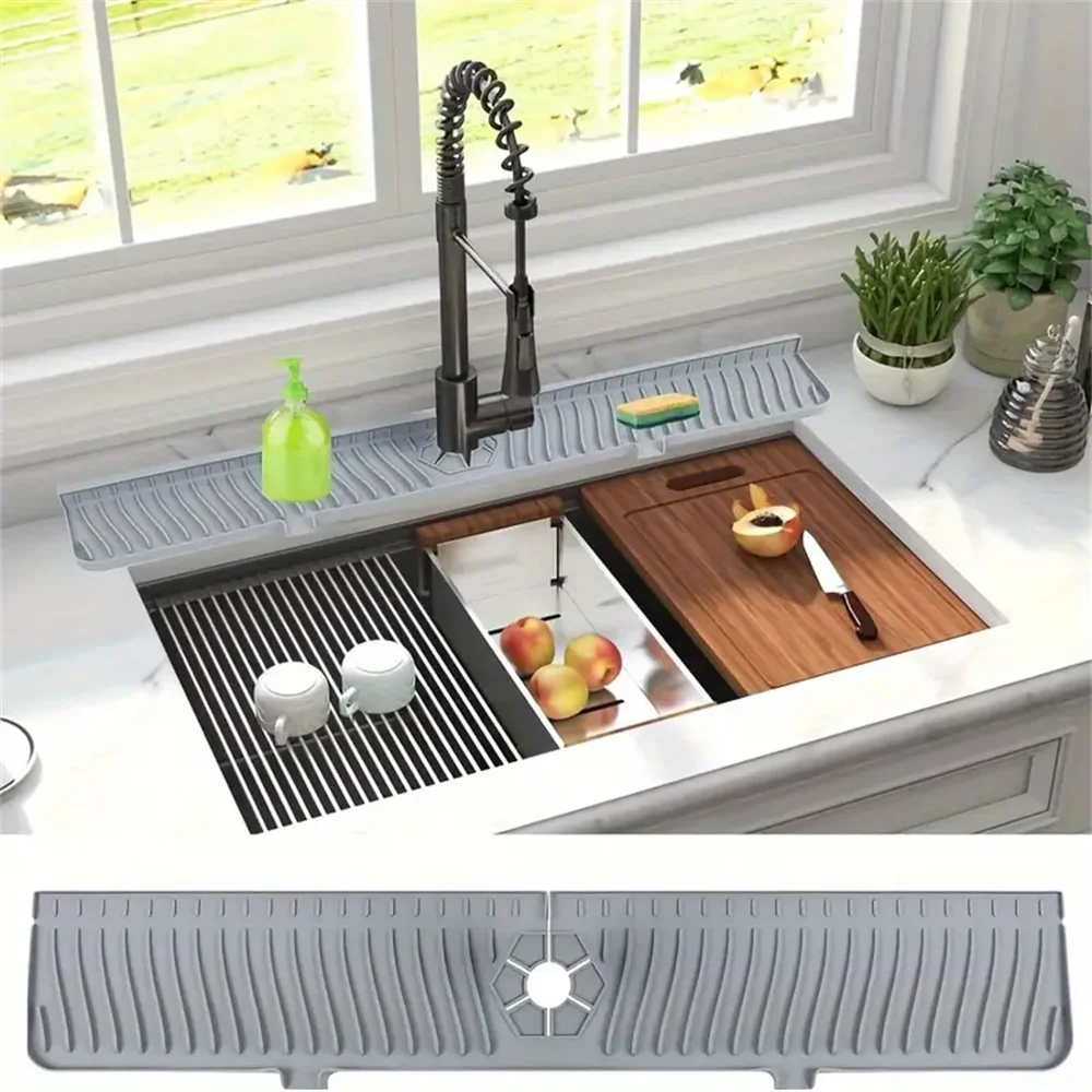 A silicone faucet drain mat is shown protecting a kitchen countertop, featuring a faucet and fruit.
